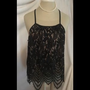 Ladies love Fire size XL sleeveless top. NWT